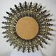Large Italian sunburst wall mirror in gilded metal, 1960s-70s.