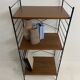 small vintage metal and teak string bookshelf