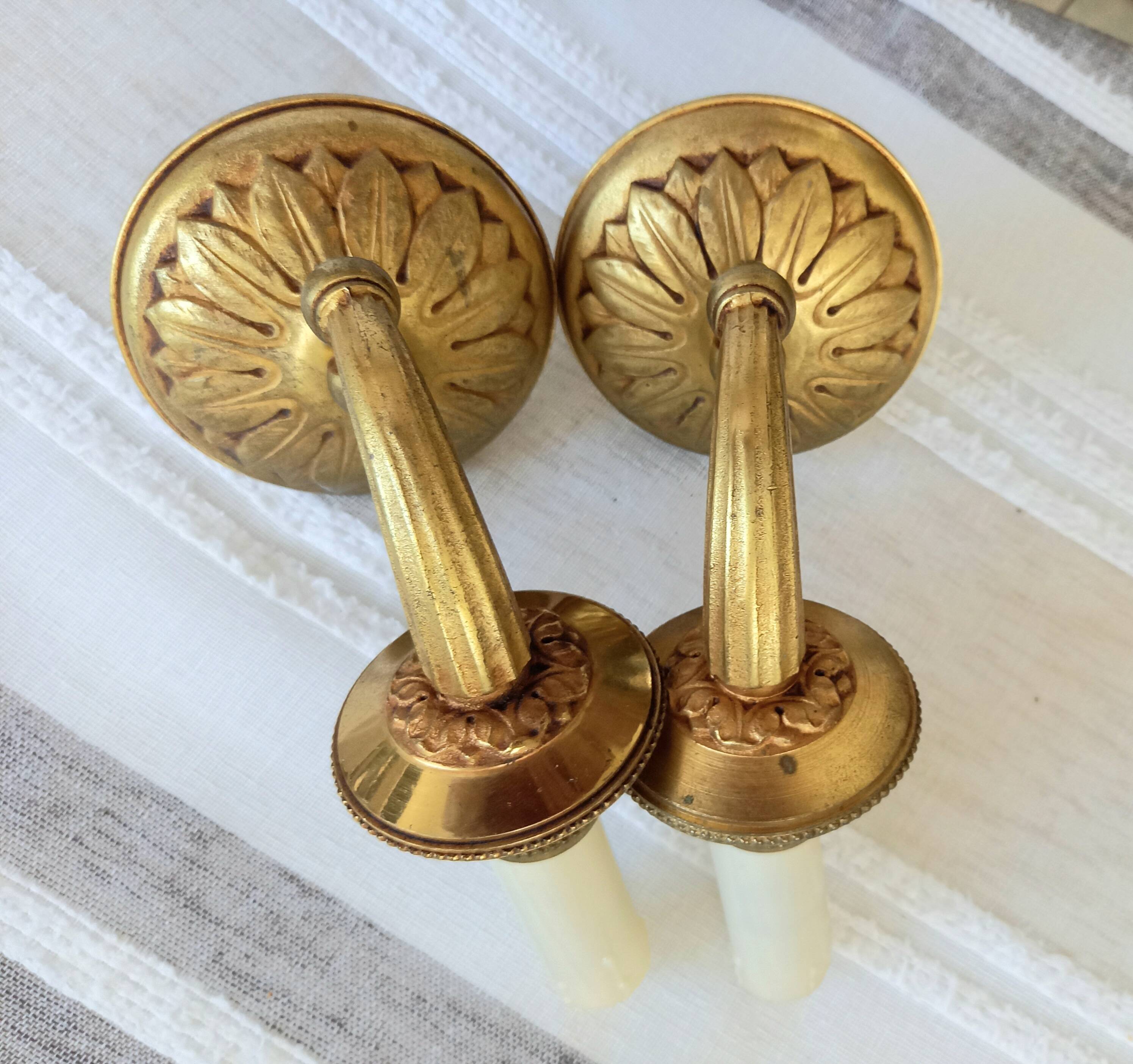 Electrified bronze gold wall sconces... in pairs.