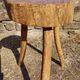 Rustic three-legged stool in minimalist wood in the style of Touret.