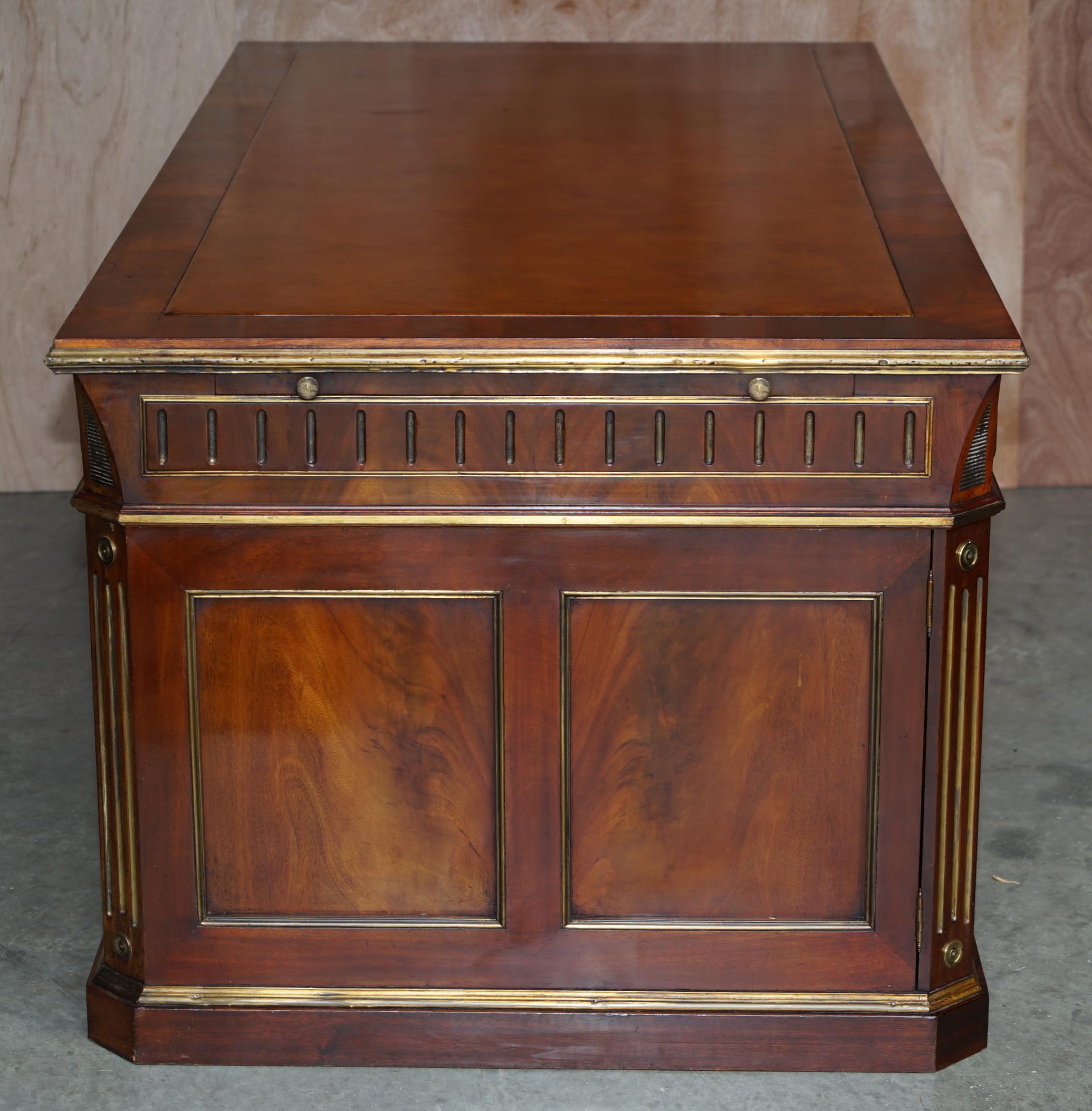 Restored antique Russian hardwood partner desk and leather armchair.