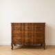 Antique curved wooden commode in classic style