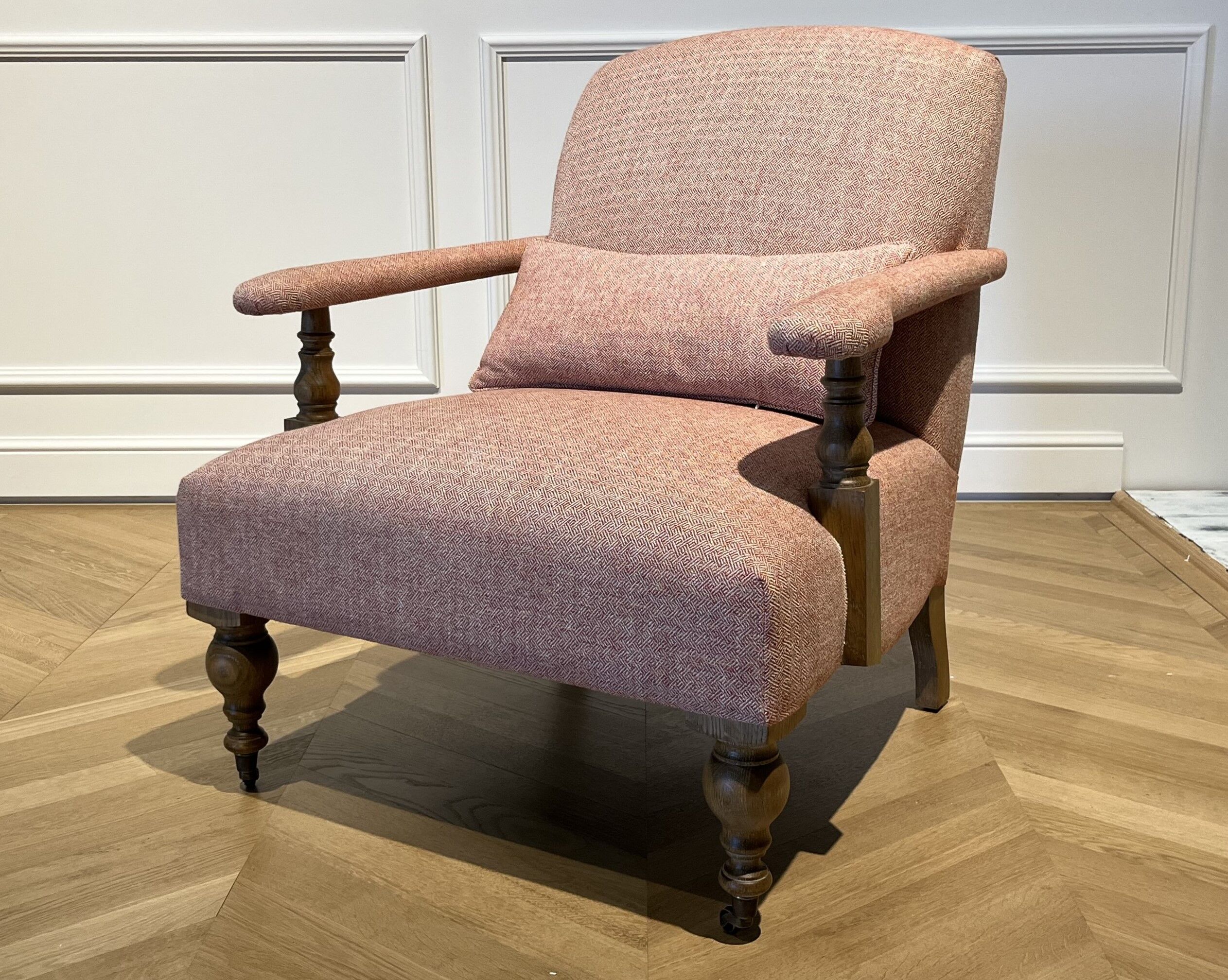 Wooden and red chevron fabric armchair with casters