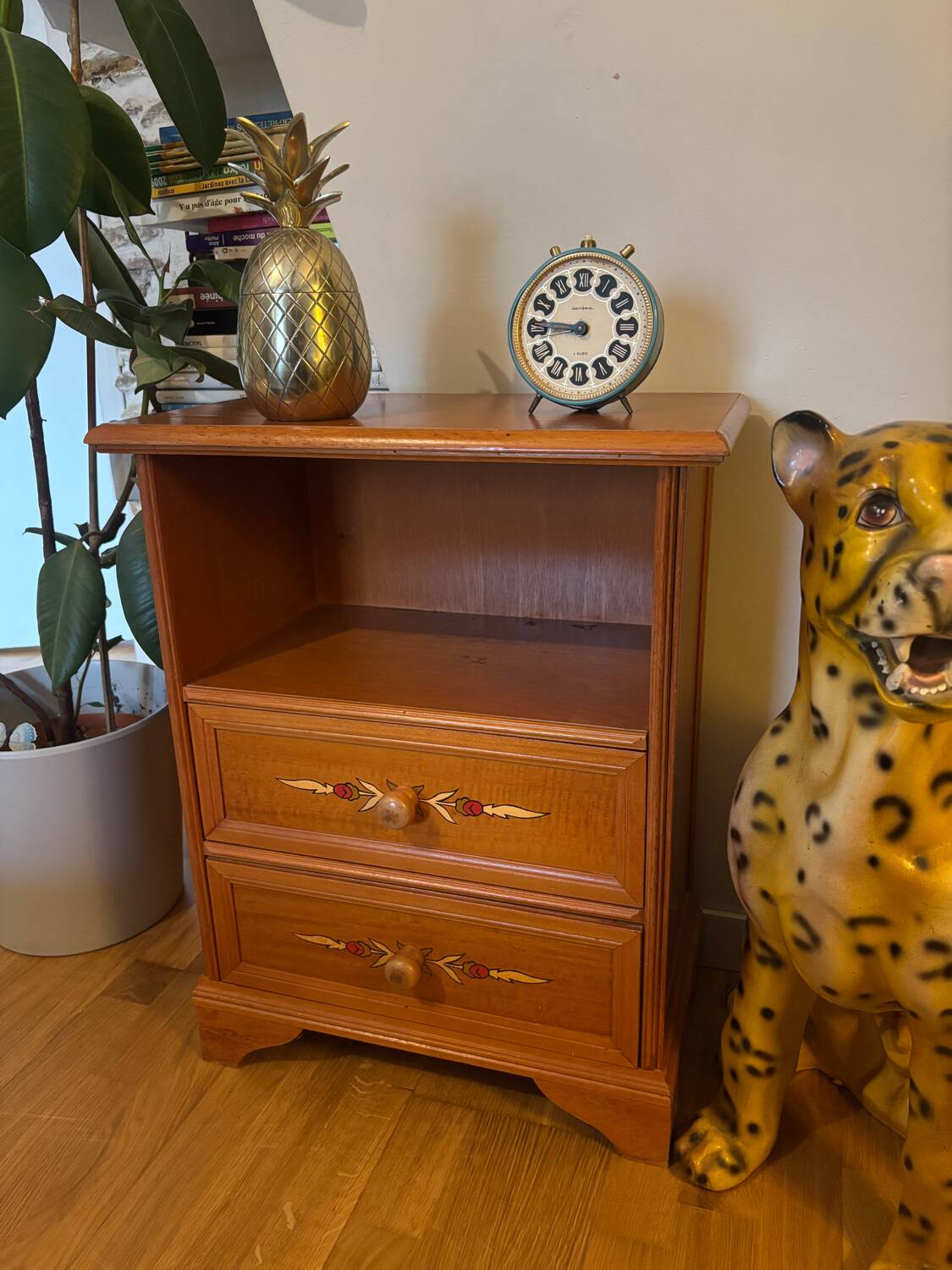 Vintage bedside table with floral decor