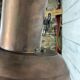 Wall lamp in copper and brass