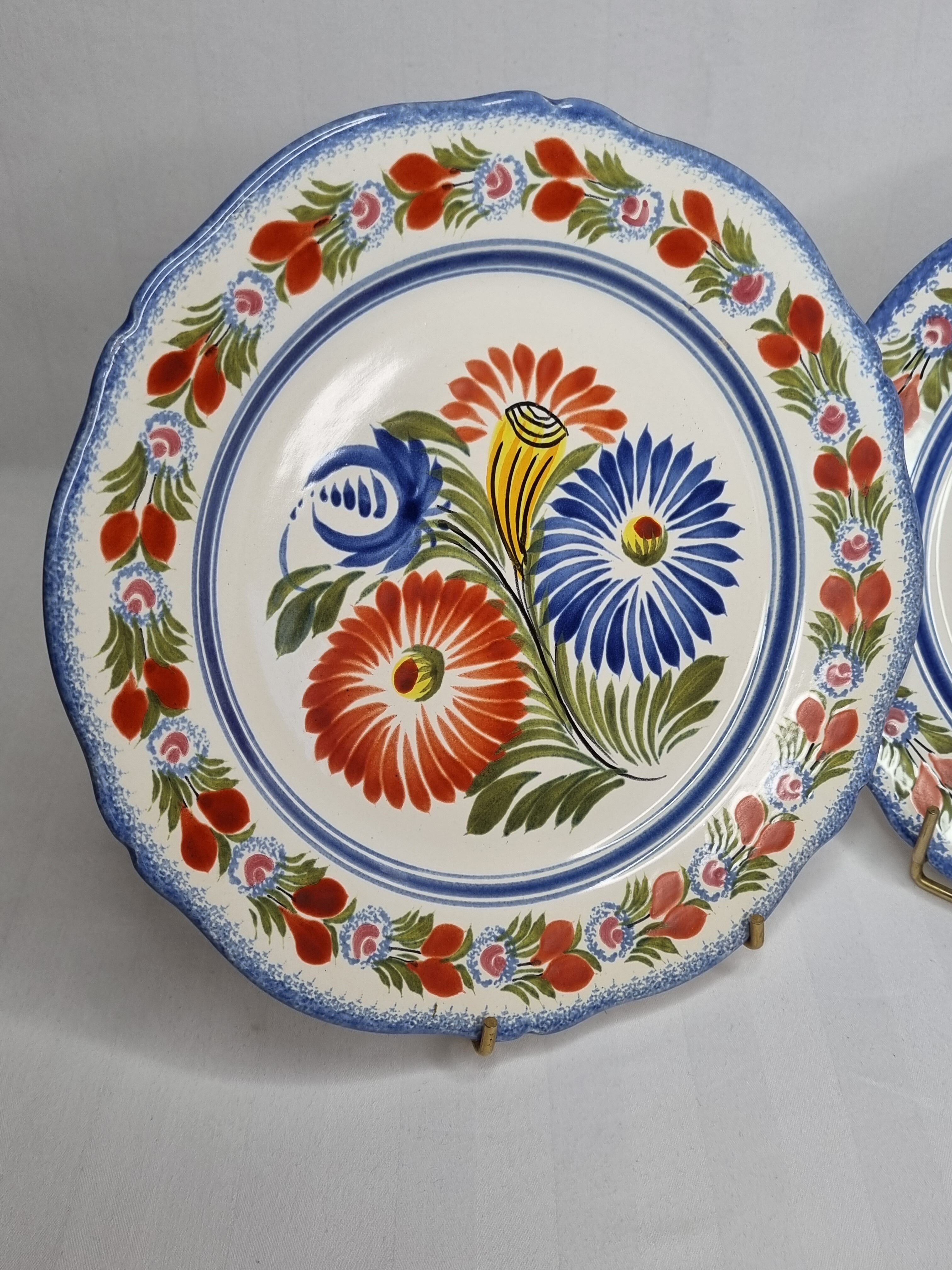 Pair of Henriot Quimper plates decorated with flower, 24 cm