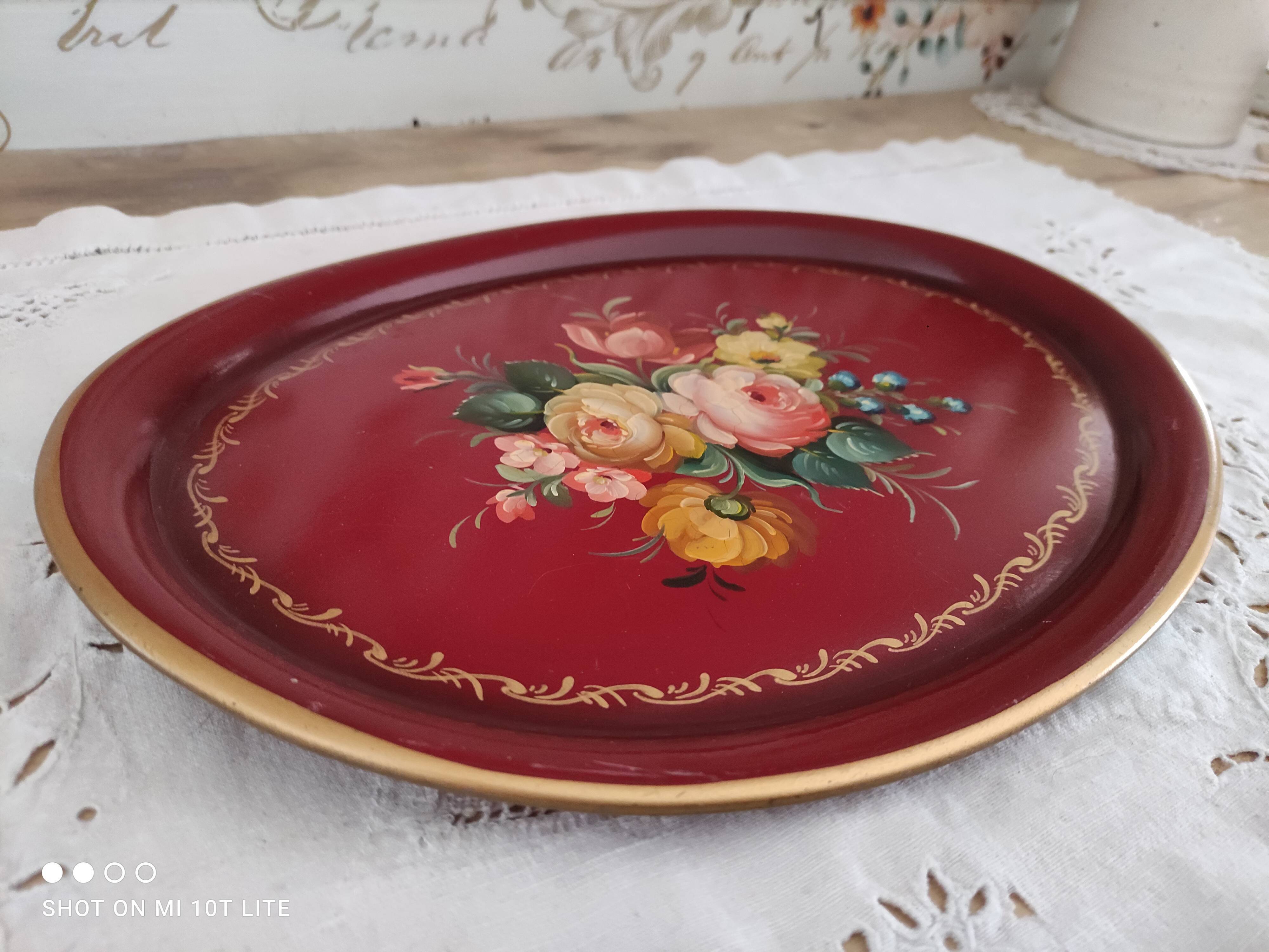 Russian plate in painted sheet metal burgundy old pink decoration and golden frieze