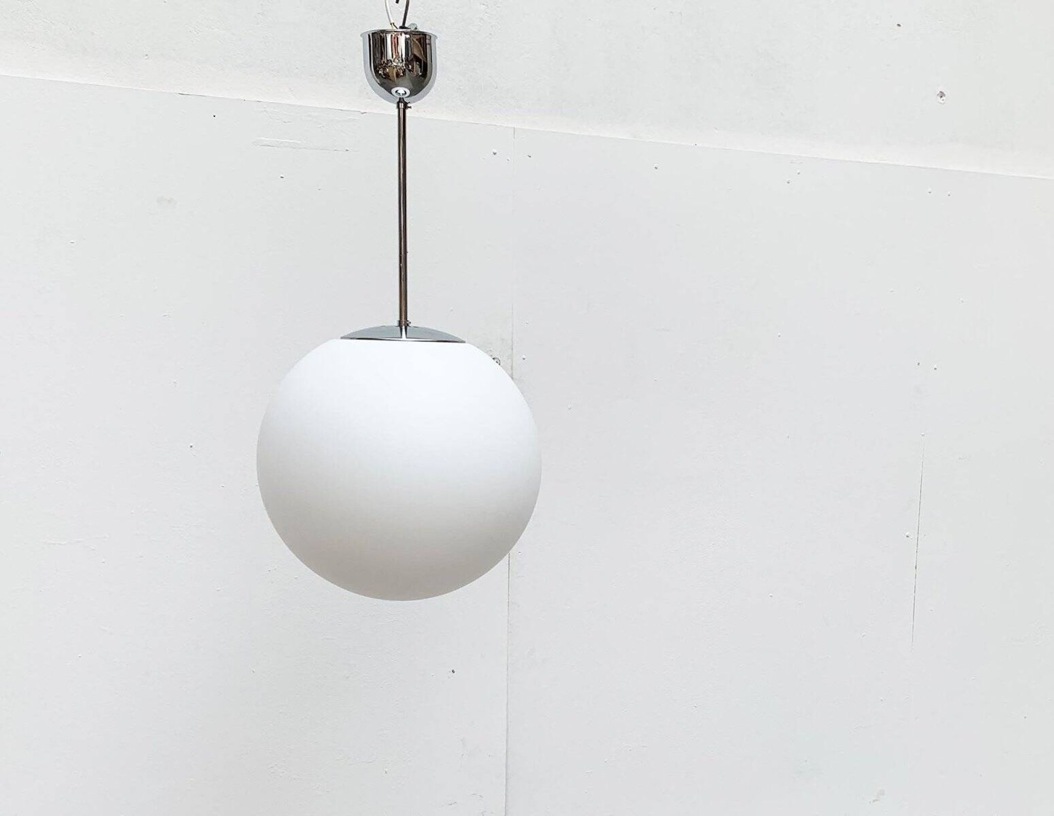 Vintage German space age glass ball pendant lamp by Limburg.