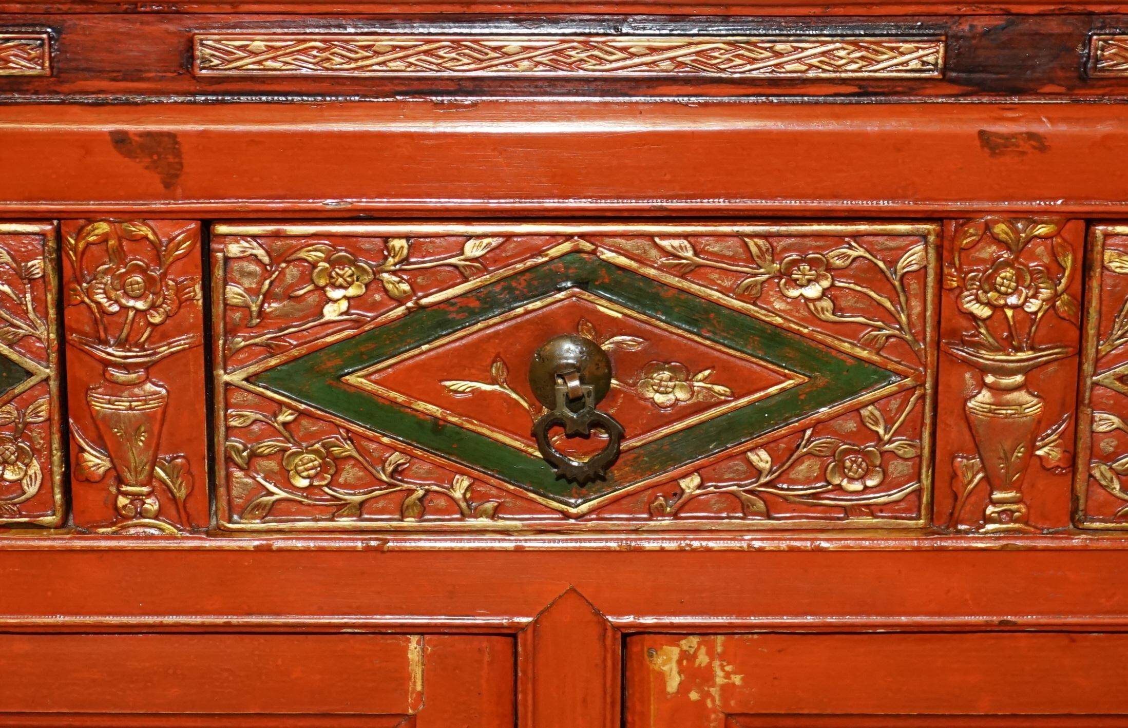 Vintage Chinese lacquered buffet decorated with gold leaf.
