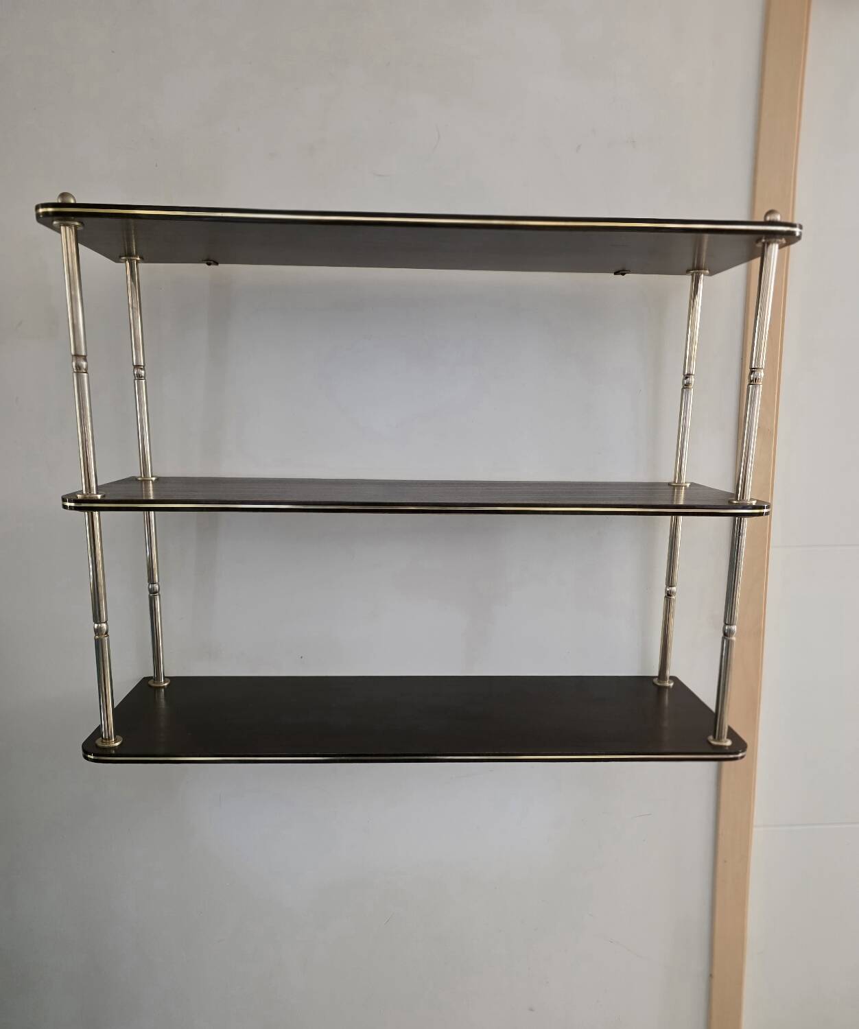 Wooden shelf with gold metal