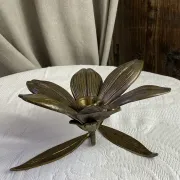 Flower candlestick and removable ashtrays in solid brass.
