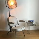 Vintage hairdresser's armchair with helmet transformed into a lamp