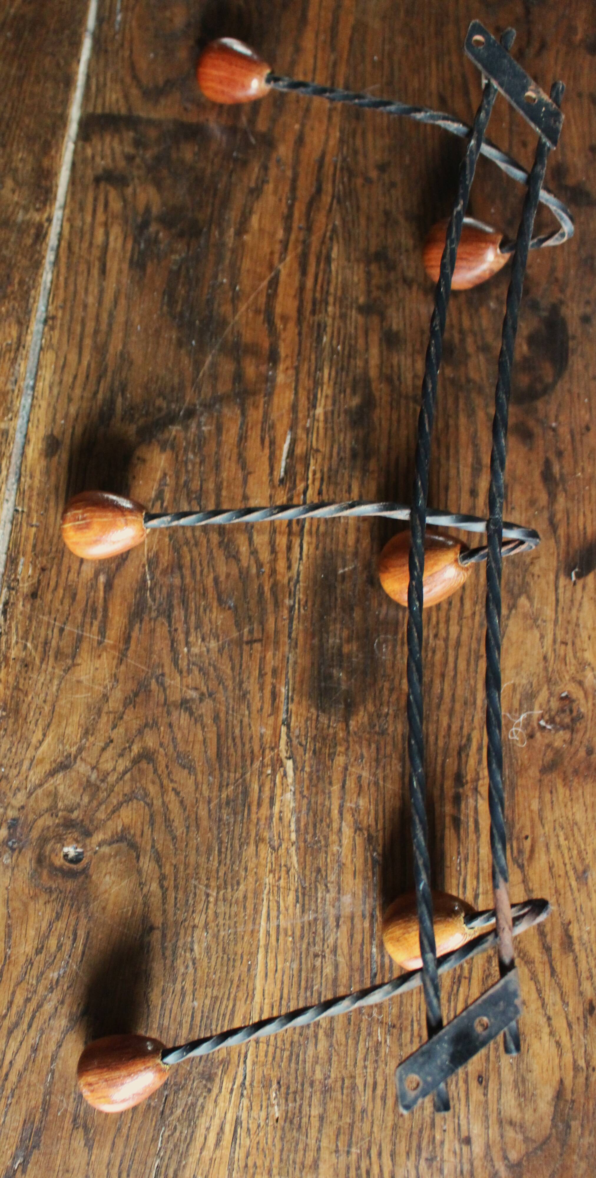 Double wrought iron coat rack with 3 double wooden ball hooks