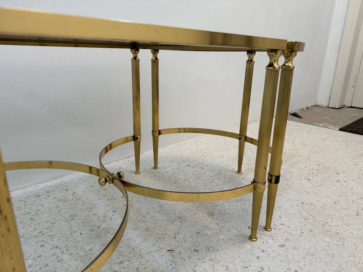 Neo classic coffee table in brass and smoked glass