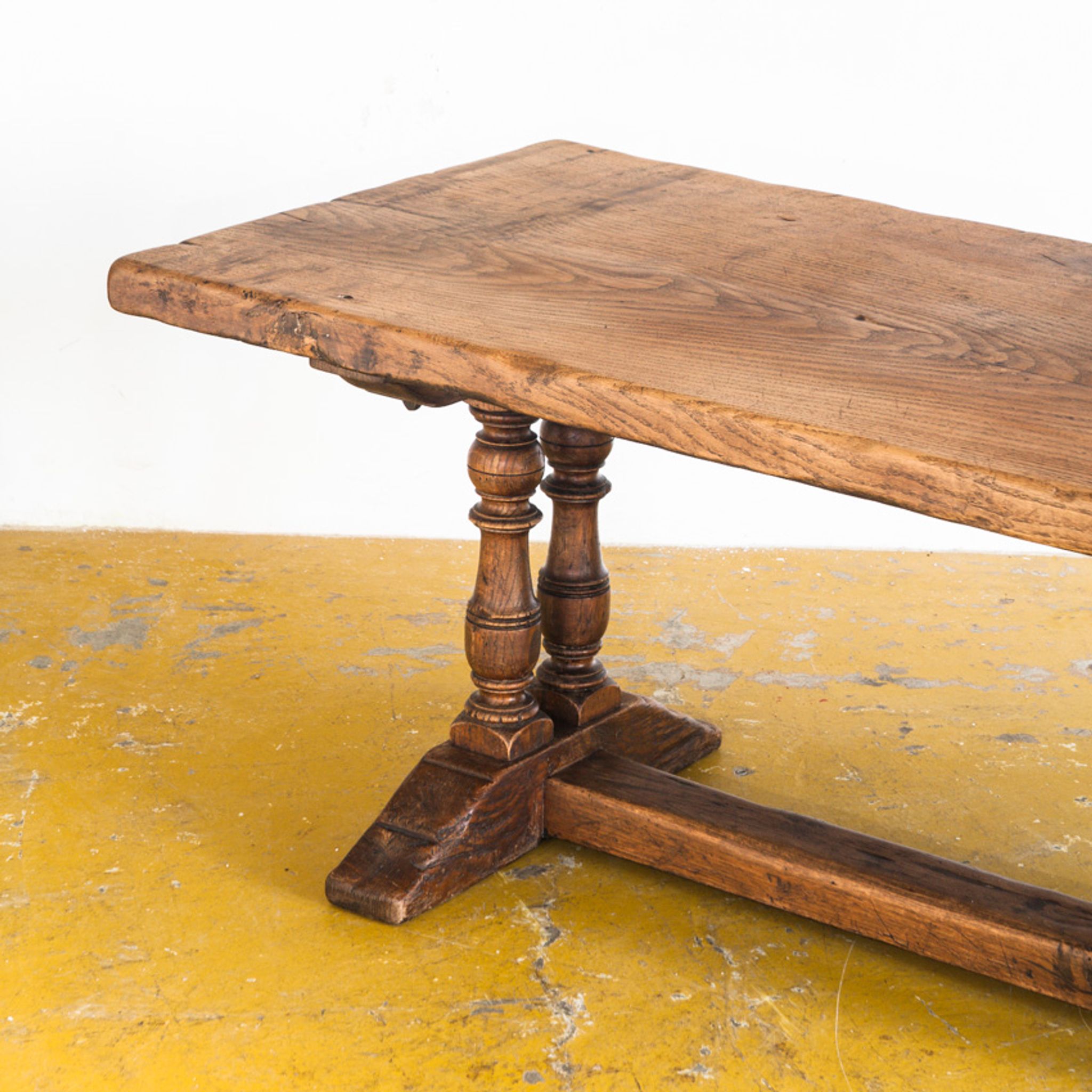 Old coffee table in solid oak wood. France, early twentieth century.