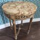 Antique Louis XVI style gueridon with veined marble, painted and patinated gilded wood.