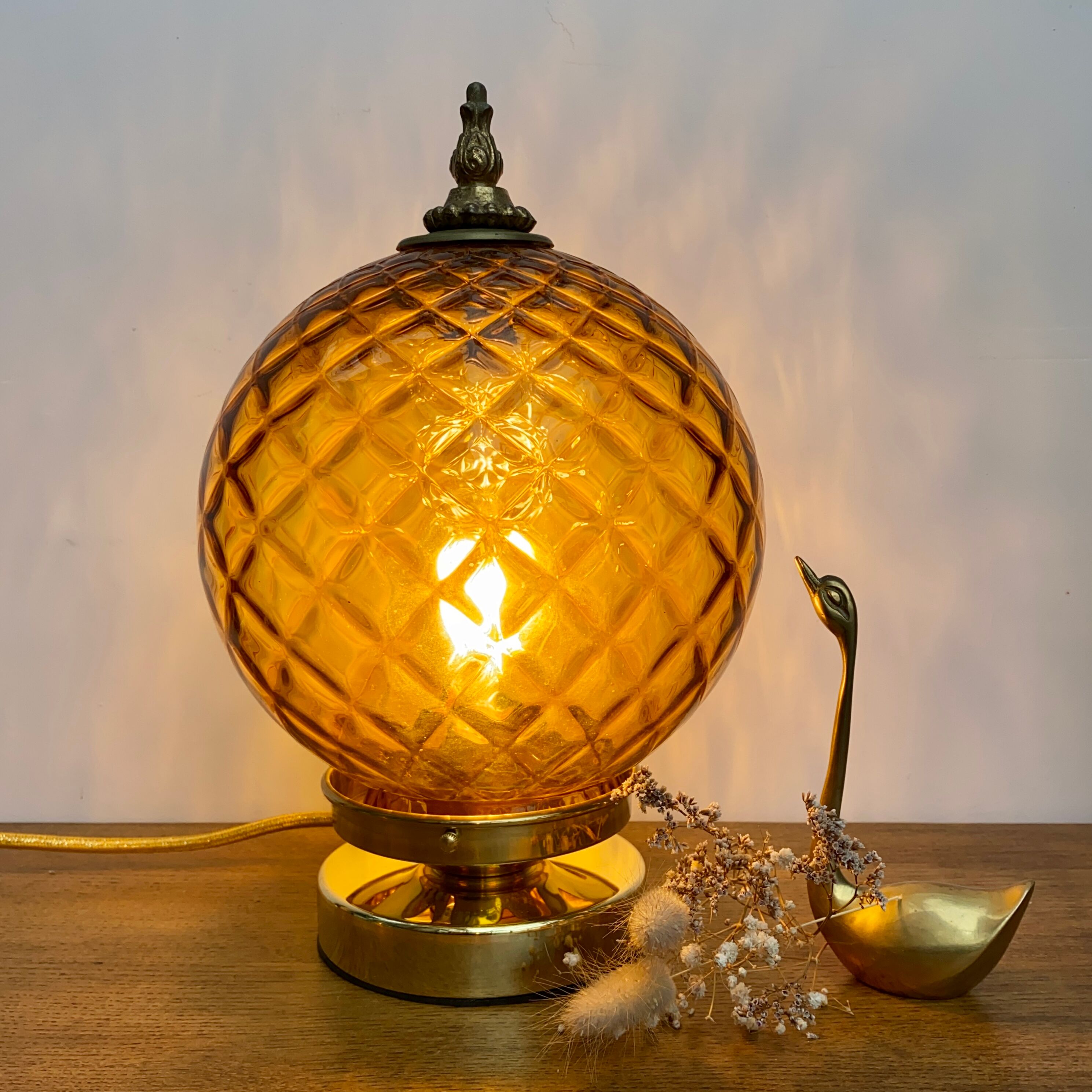 Vintage amber glass globe laying lamp with brass detail