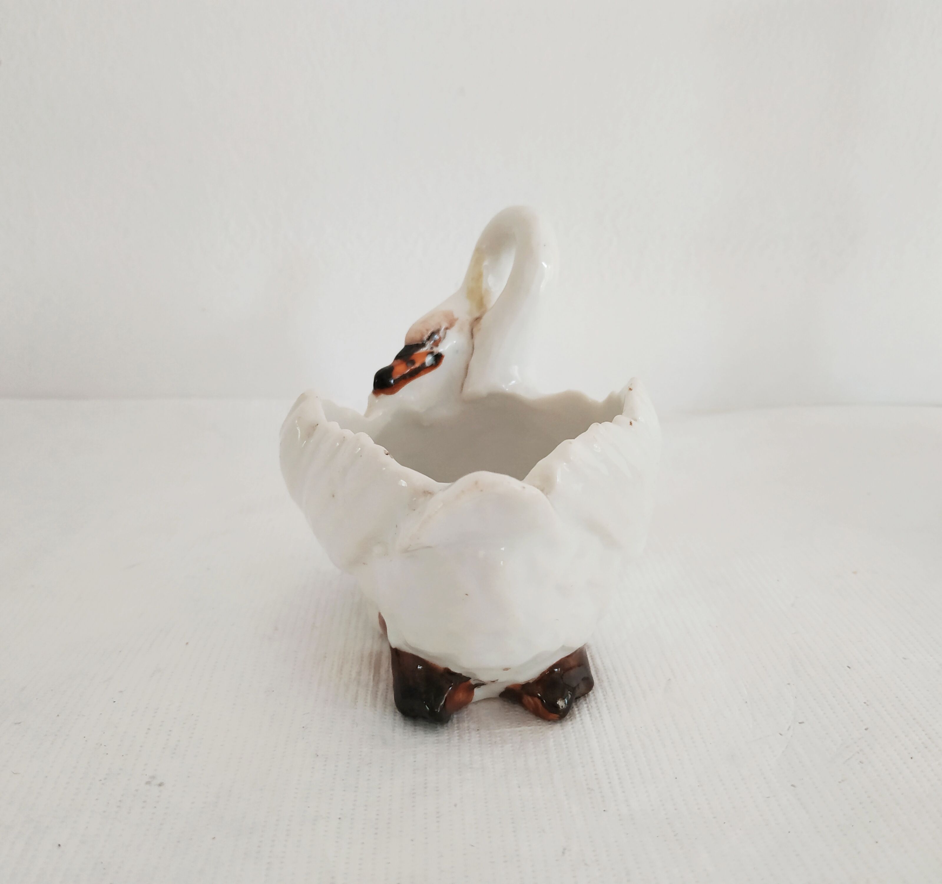 Mustard and salty swans, circa 1900