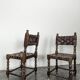 Pair of Spanish style chairs with leather straps.