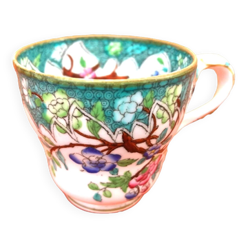 Antique porcelain cup in the Minton style with Japanese decoration.