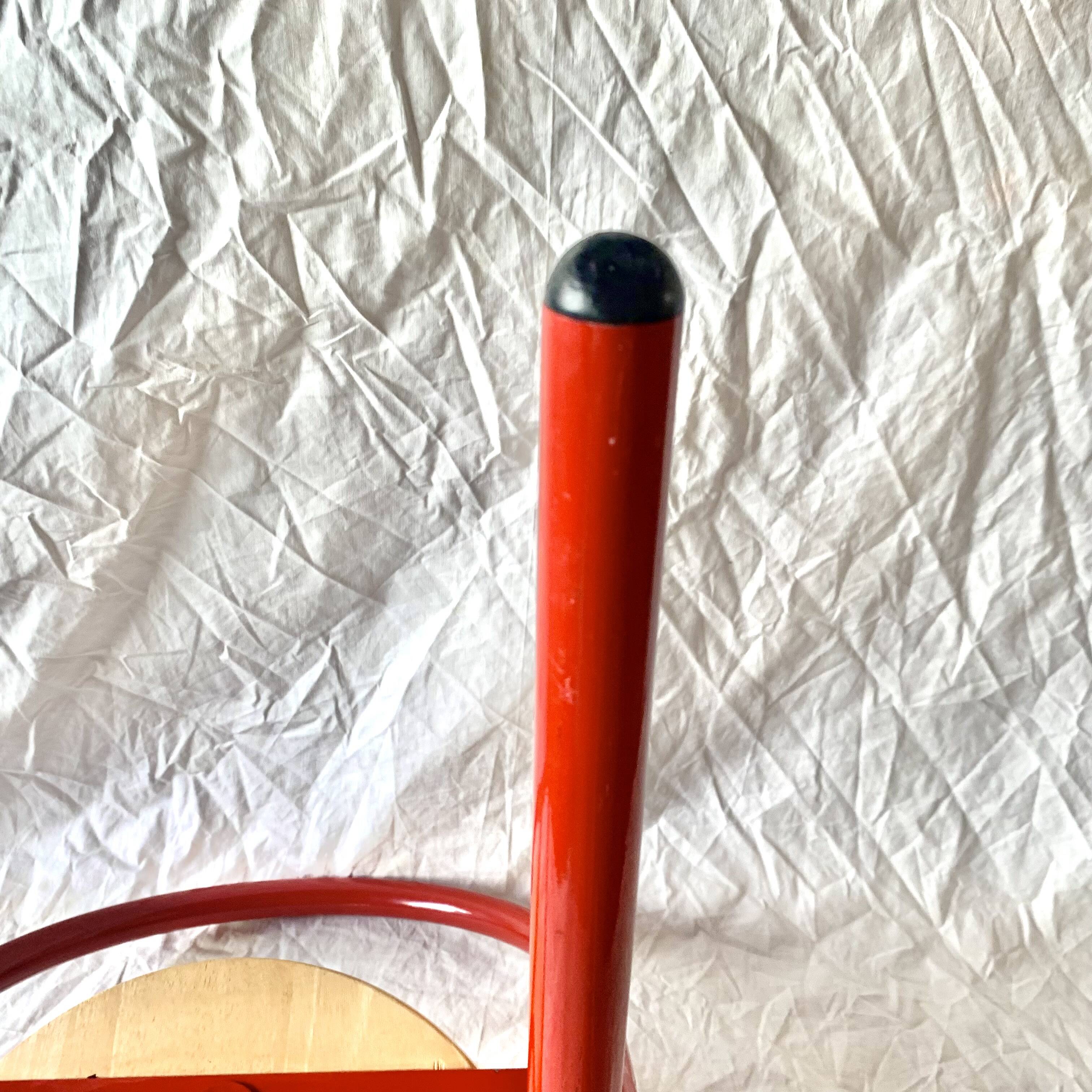 Vintage folding chair in red painted metal and wood