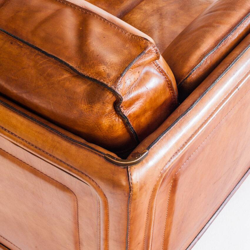 Vintage club armchair by Roche Bobois. Camel buffalo leather. France, 1980s.