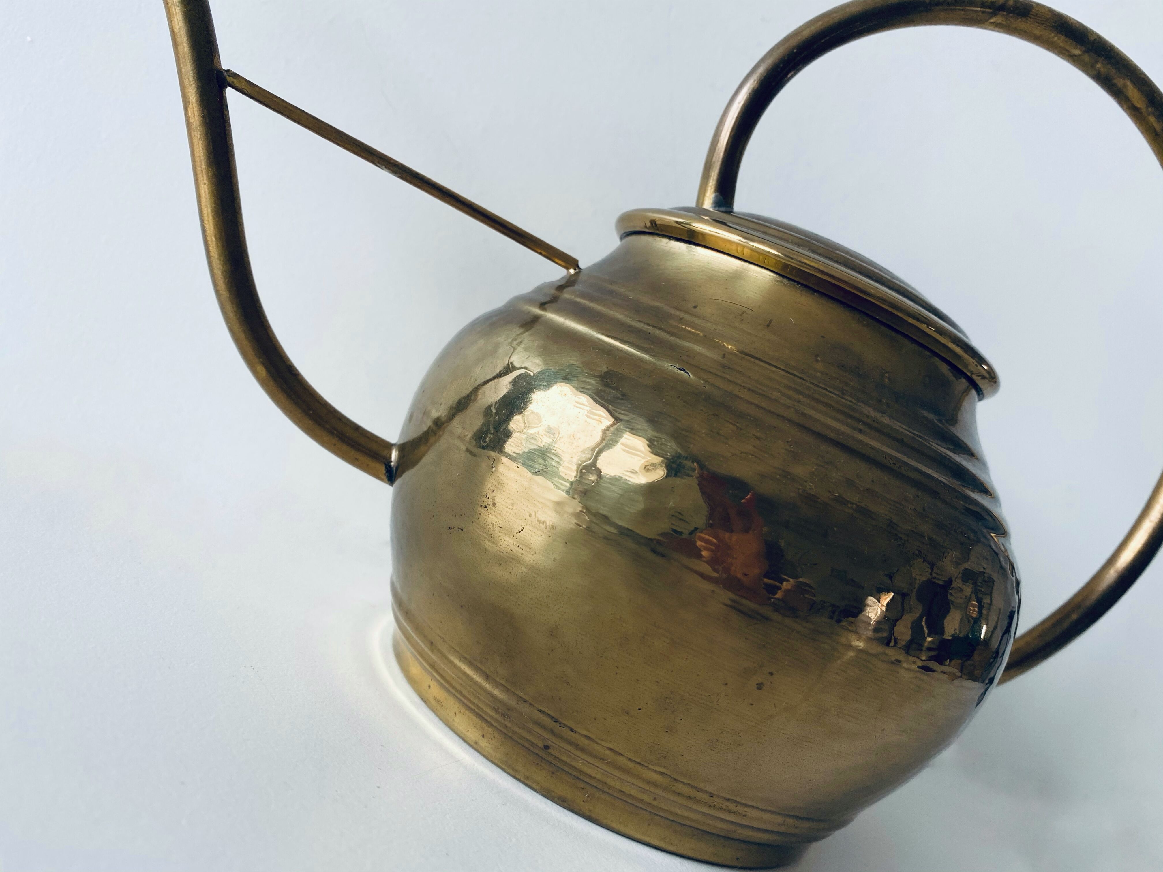 Old brass watering can