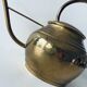 Old brass watering can
