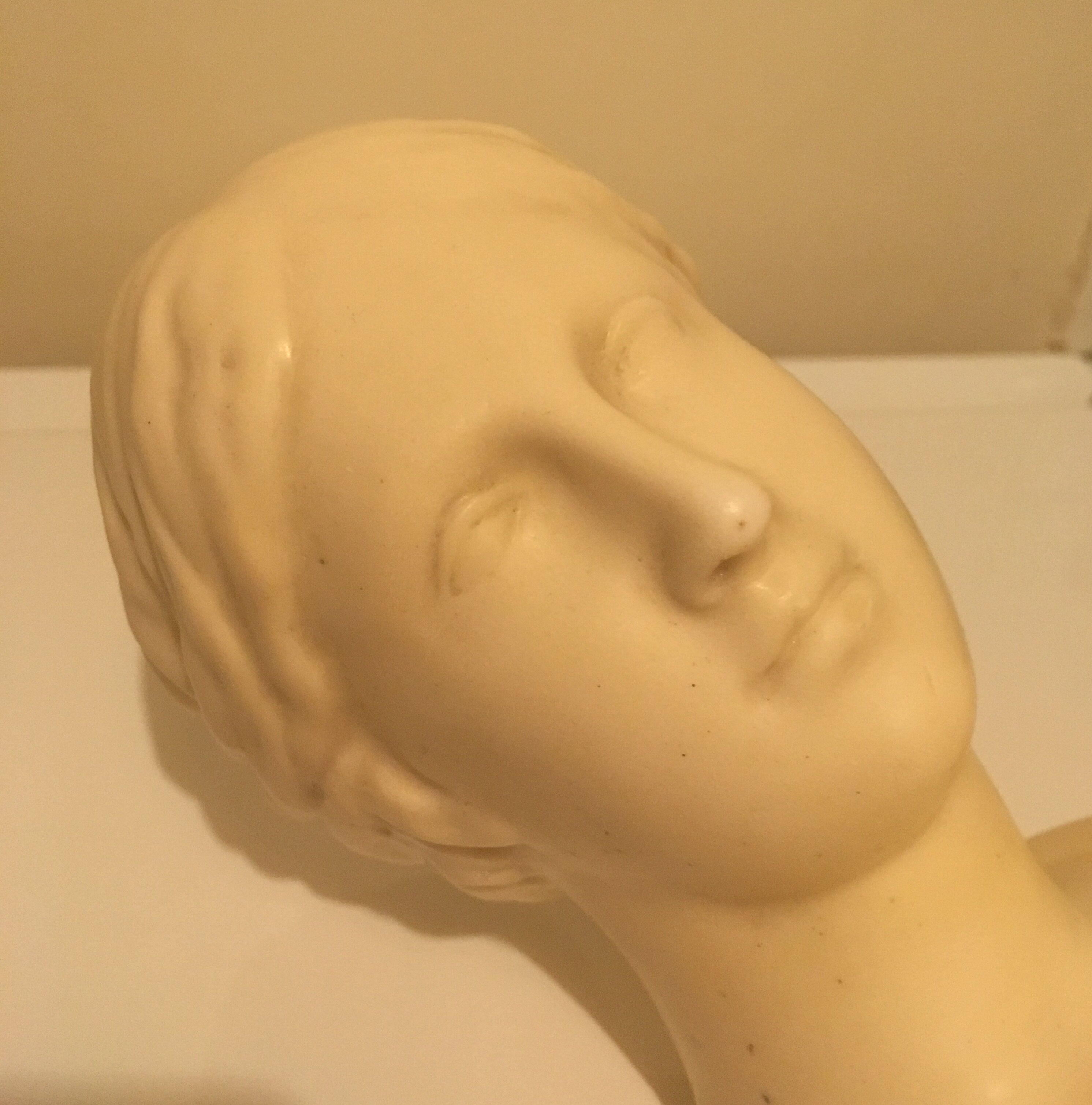 Bust of woman in off-white biscuit