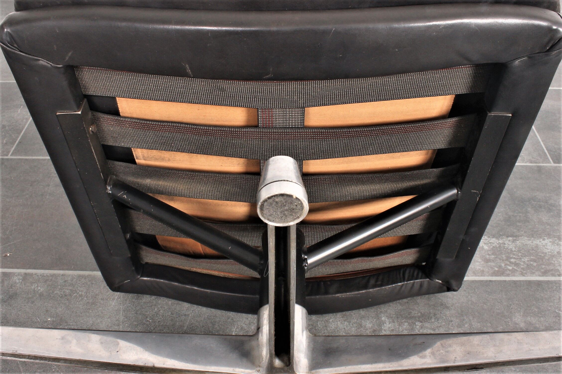 Armchair and footstool by André Vandenbeuck for Strässle in black leather