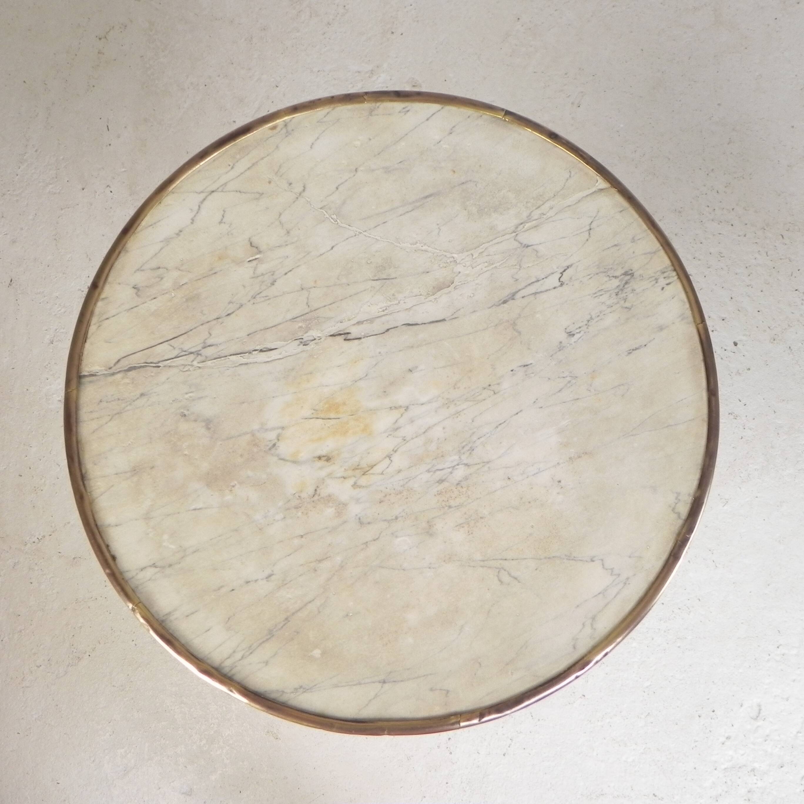 Bistro table with a marble top and brass edging, early 20th century.