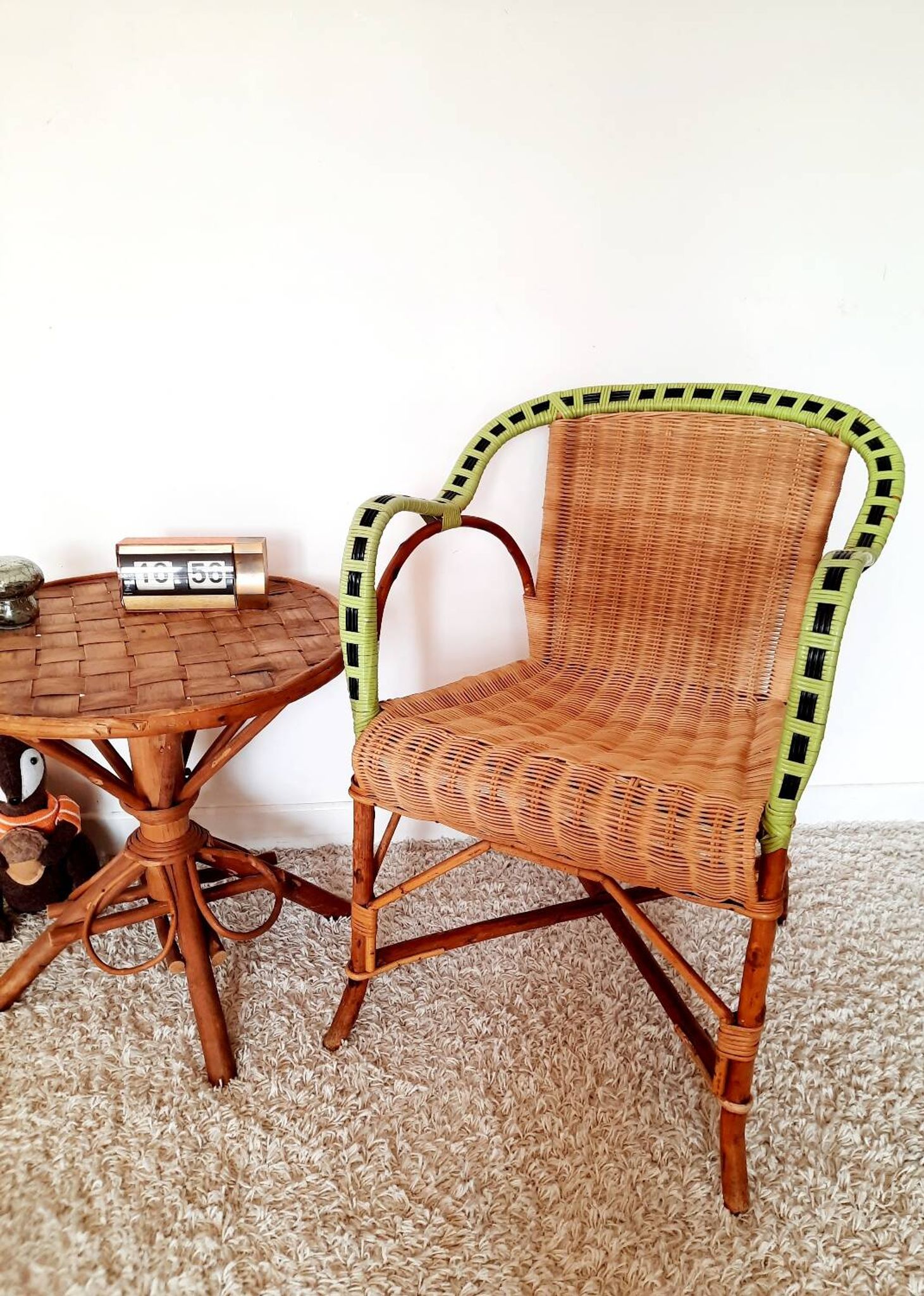 1950s 60s rattan armchair with green apple and black piping.