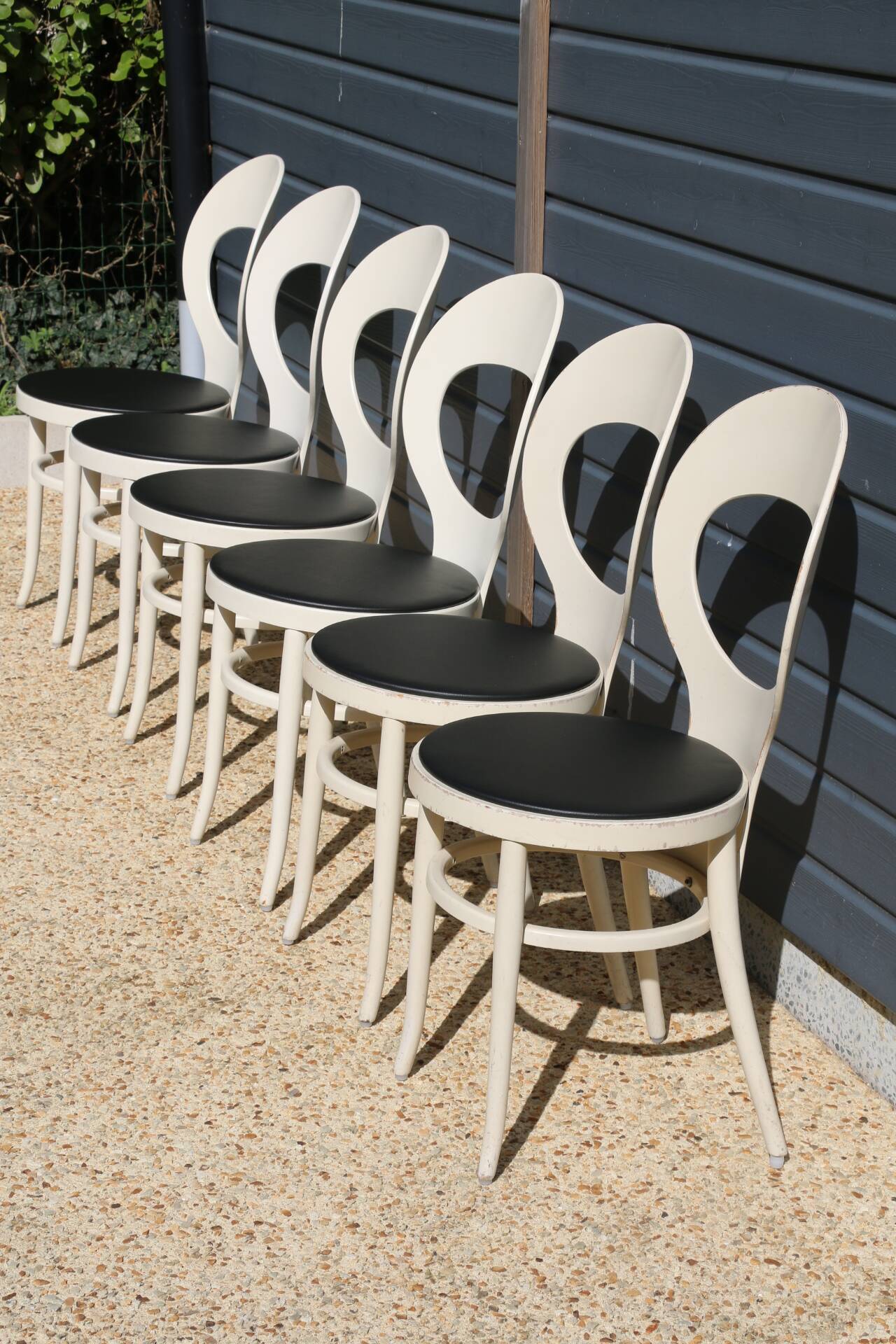 6 baumann chairs, white gull with black faux leather.