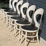6 baumann chairs, white gull with black faux leather.