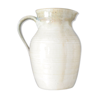 Old decanter in enamelled sandstone