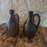 Dark brown stoneware jugs and pitchers with their cord