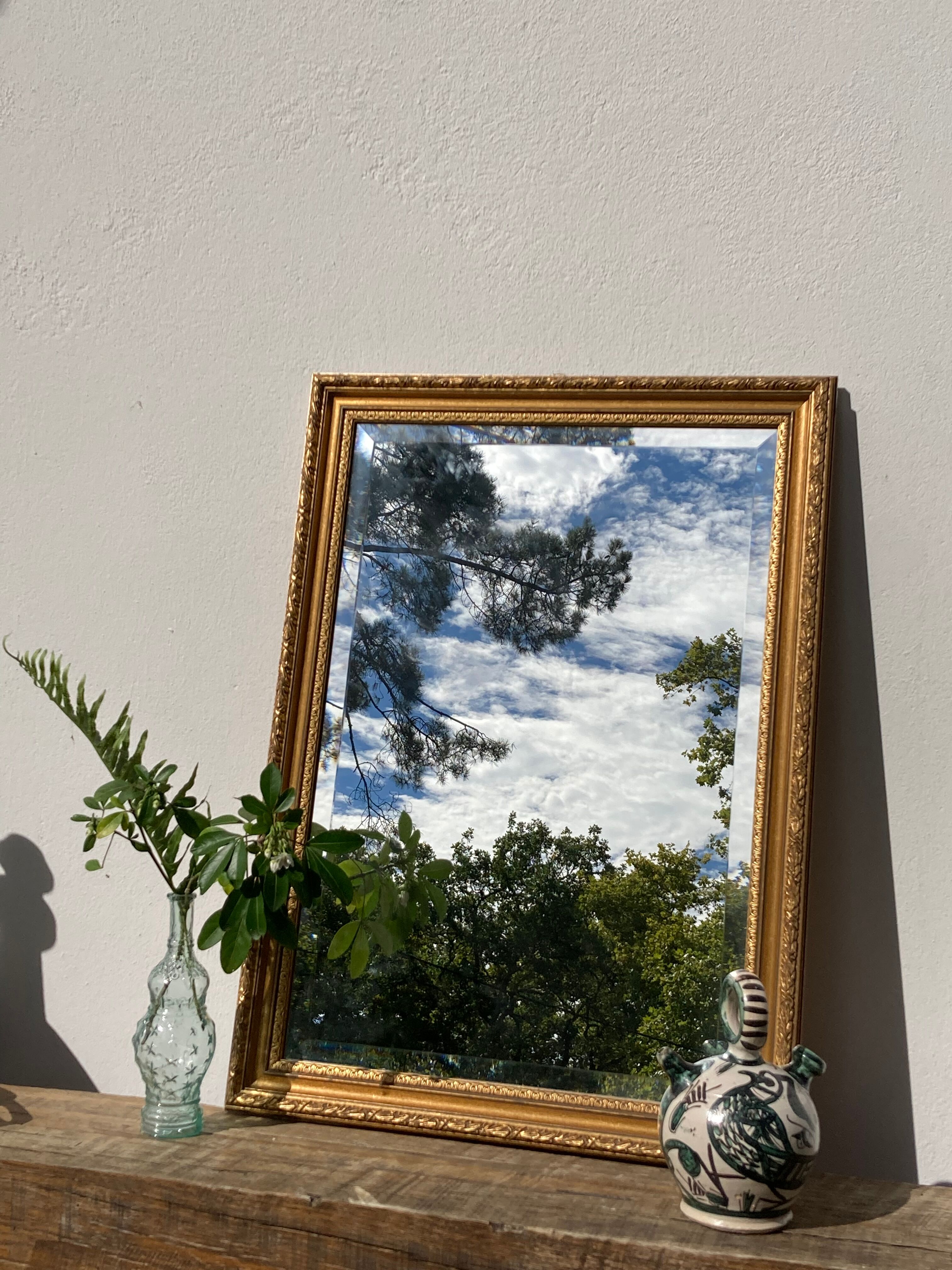 Antique mirror in rectangular beveled gilded wood in Louis XVI style