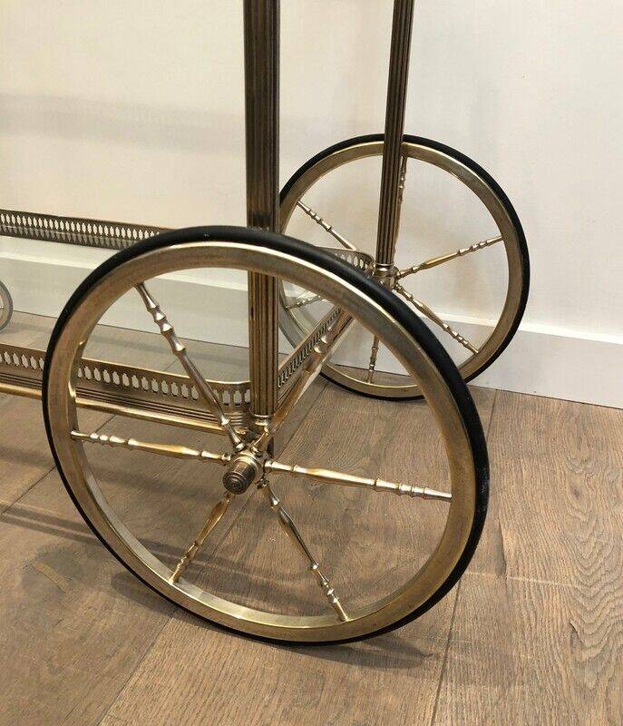 Neoclassical style rolling table in silvered brass