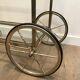 Neoclassical style rolling table in silvered brass