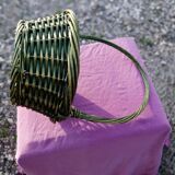 Green wicker basket with a large vintage handle