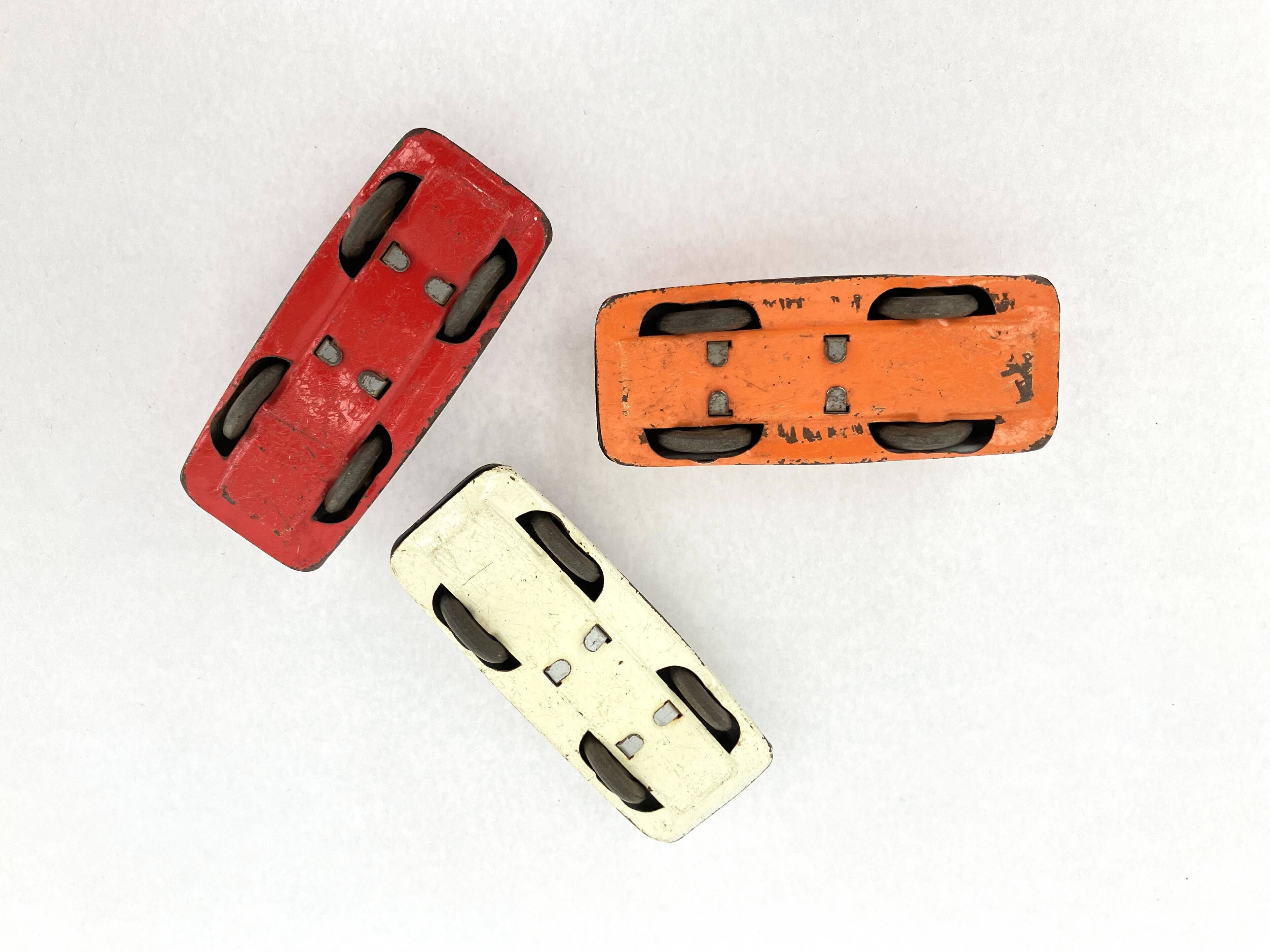 3 old small tin circuit cars with lead wheels • Vintage • 1960s