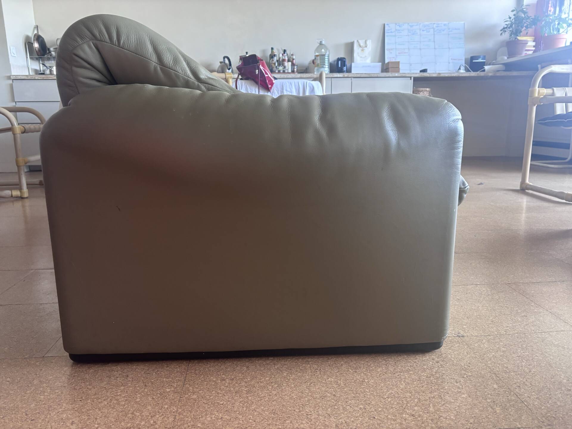 Two-seater Maralunga sofa in olive green leather.