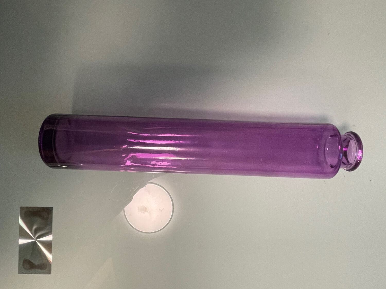 Ancient violet glass soliflore. Apothecary spirit.