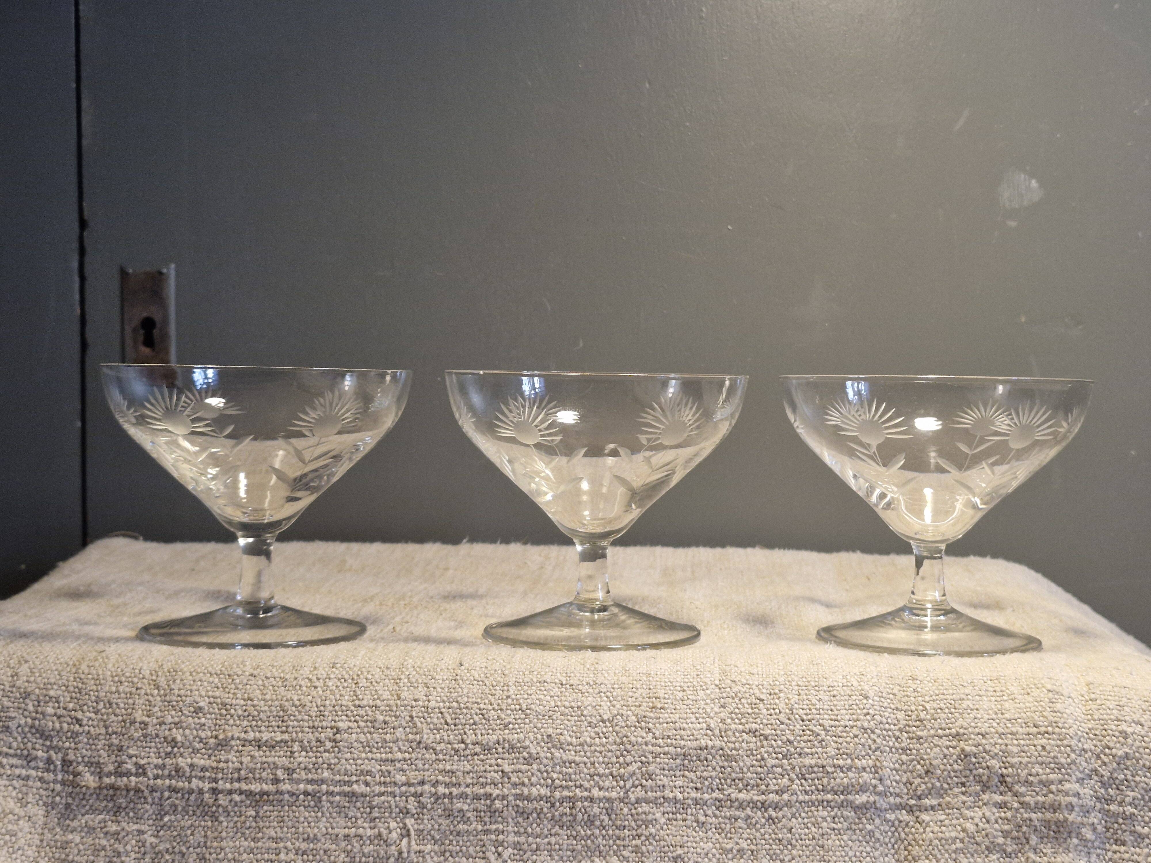 3 antique champagne coupes in engraved crystal with large daisies.