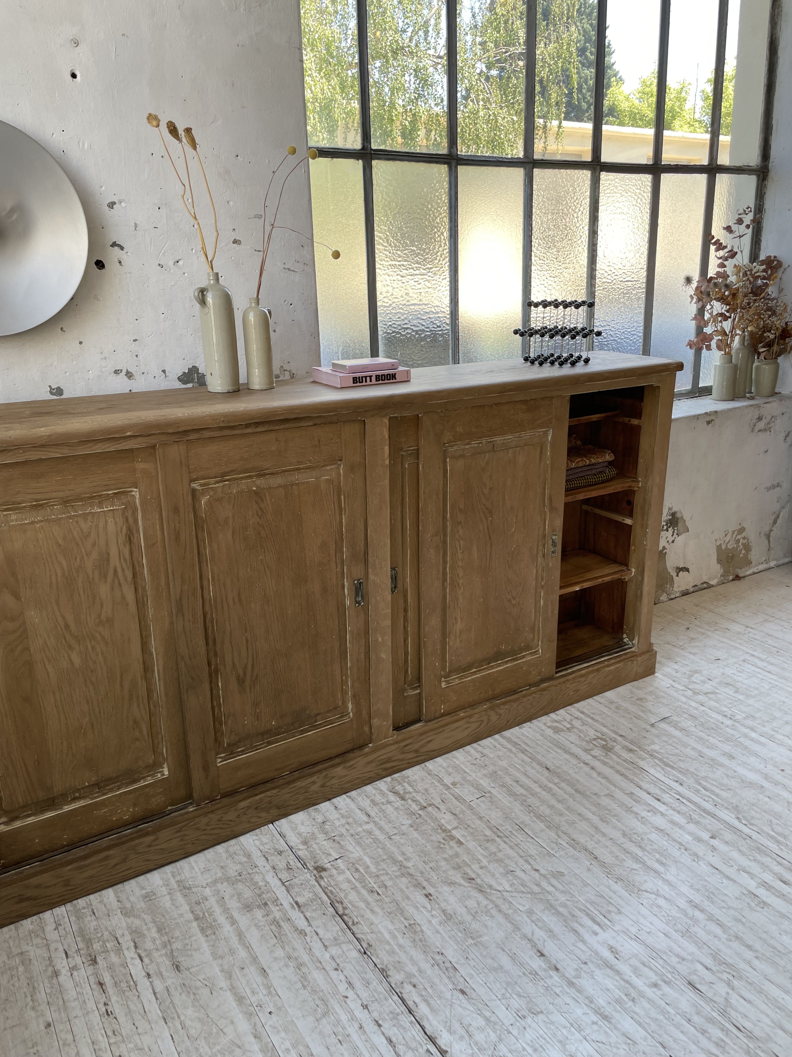 Large row of solid oak loom sliding doors