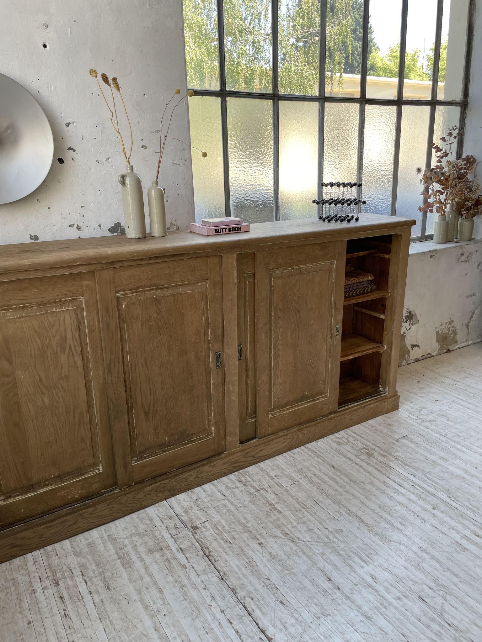 Large row of solid oak loom sliding doors