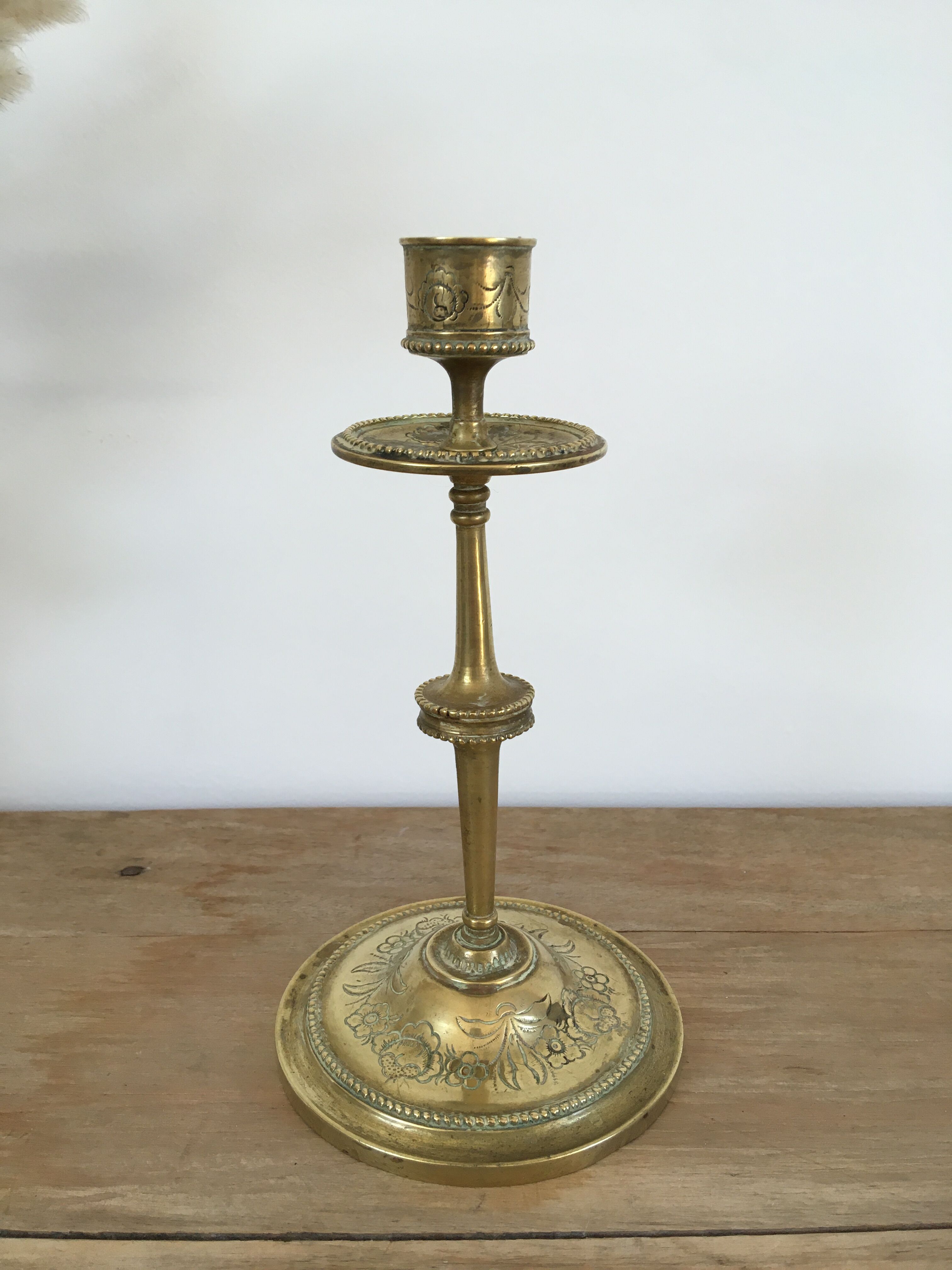 Chiseled brass candle holder
