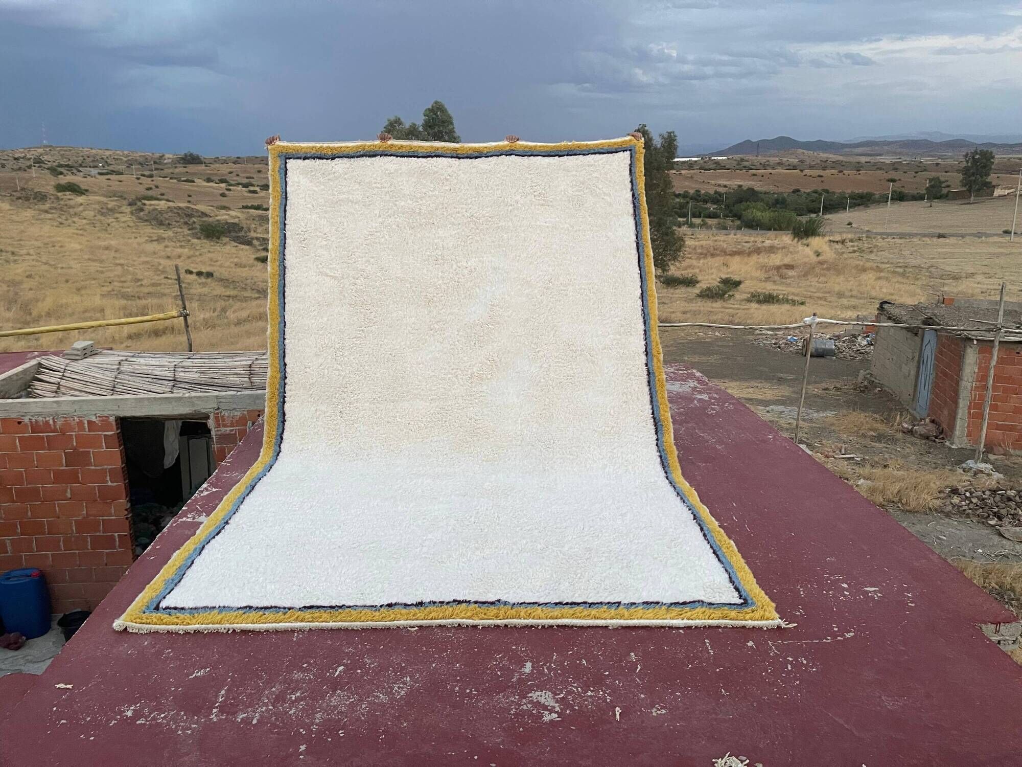 Large Moroccan Berber rug in cream 400x250 cm – yellow and blue border