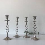 Four twisted silver candlesticks