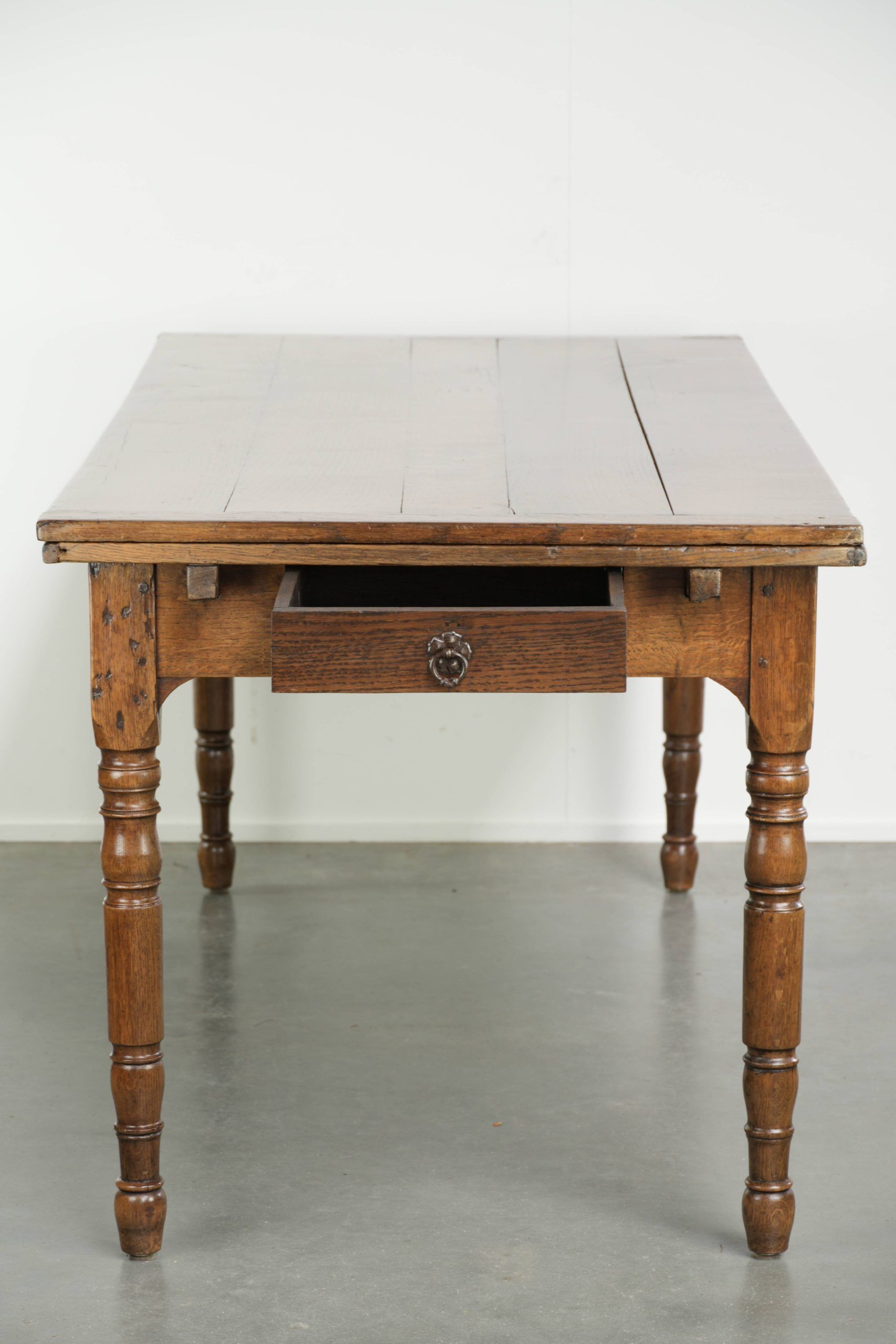 Antique oak dining table from the late 18th century with extendable leaves